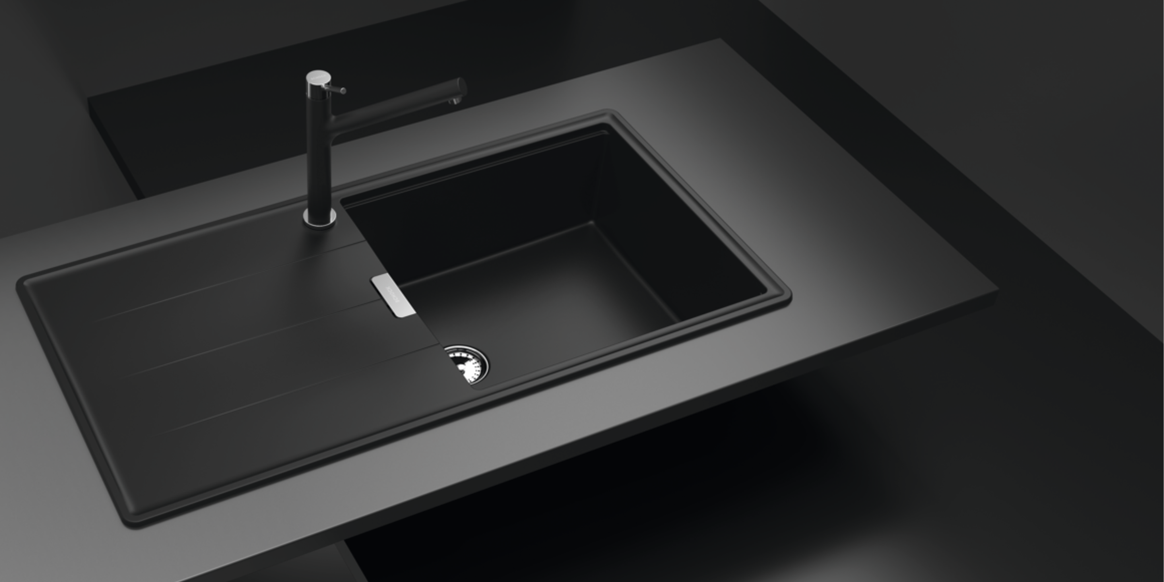 Évier en granit noir intense Luisina TEATRO avec grand bac et égouttoir intégré, offrant une robustesse et un style moderne.