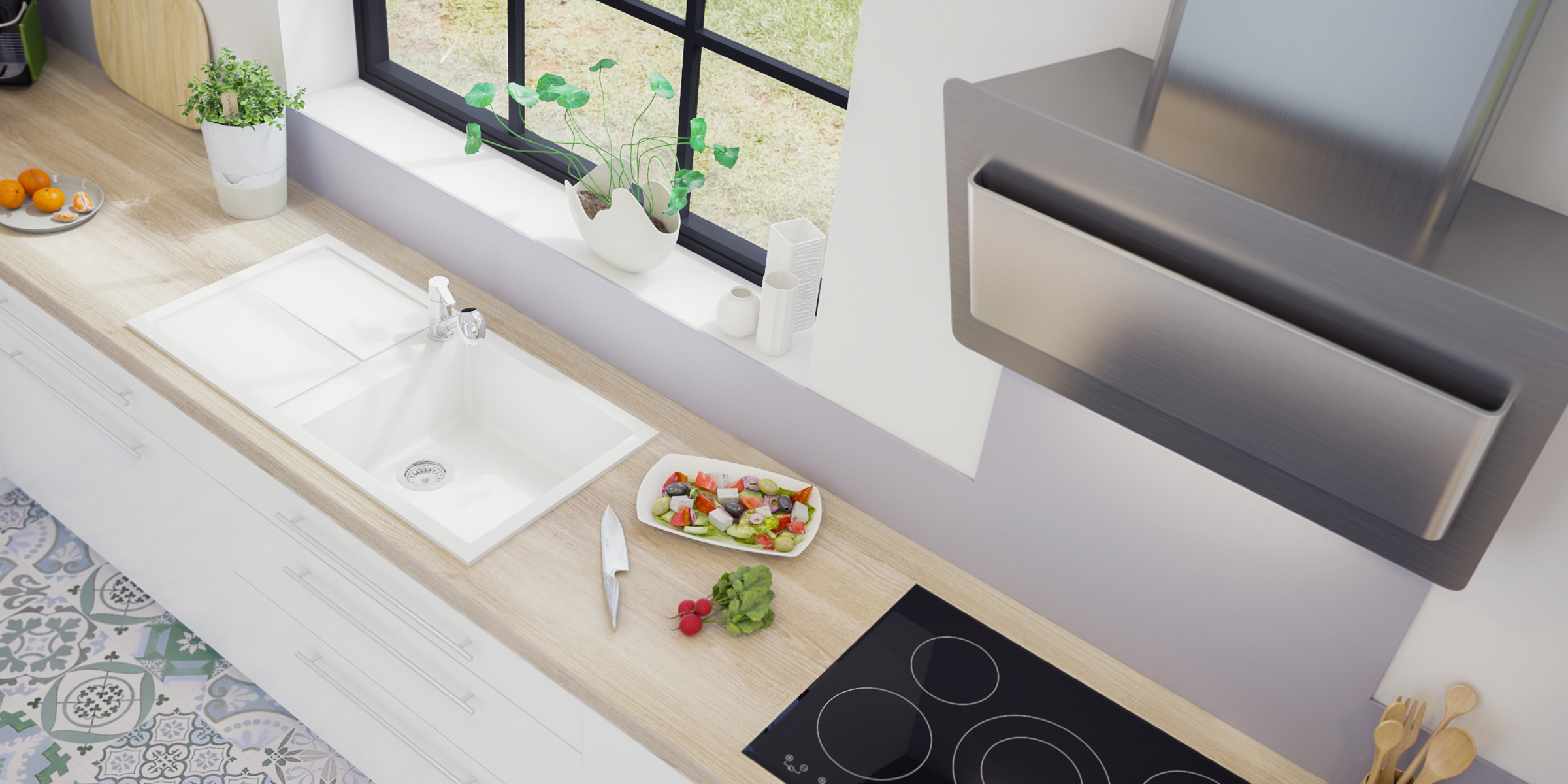 En granit blanc, l’évier MAESTOSO avec grand bac et égouttoir apporte un cachet unique à votre cuisine.