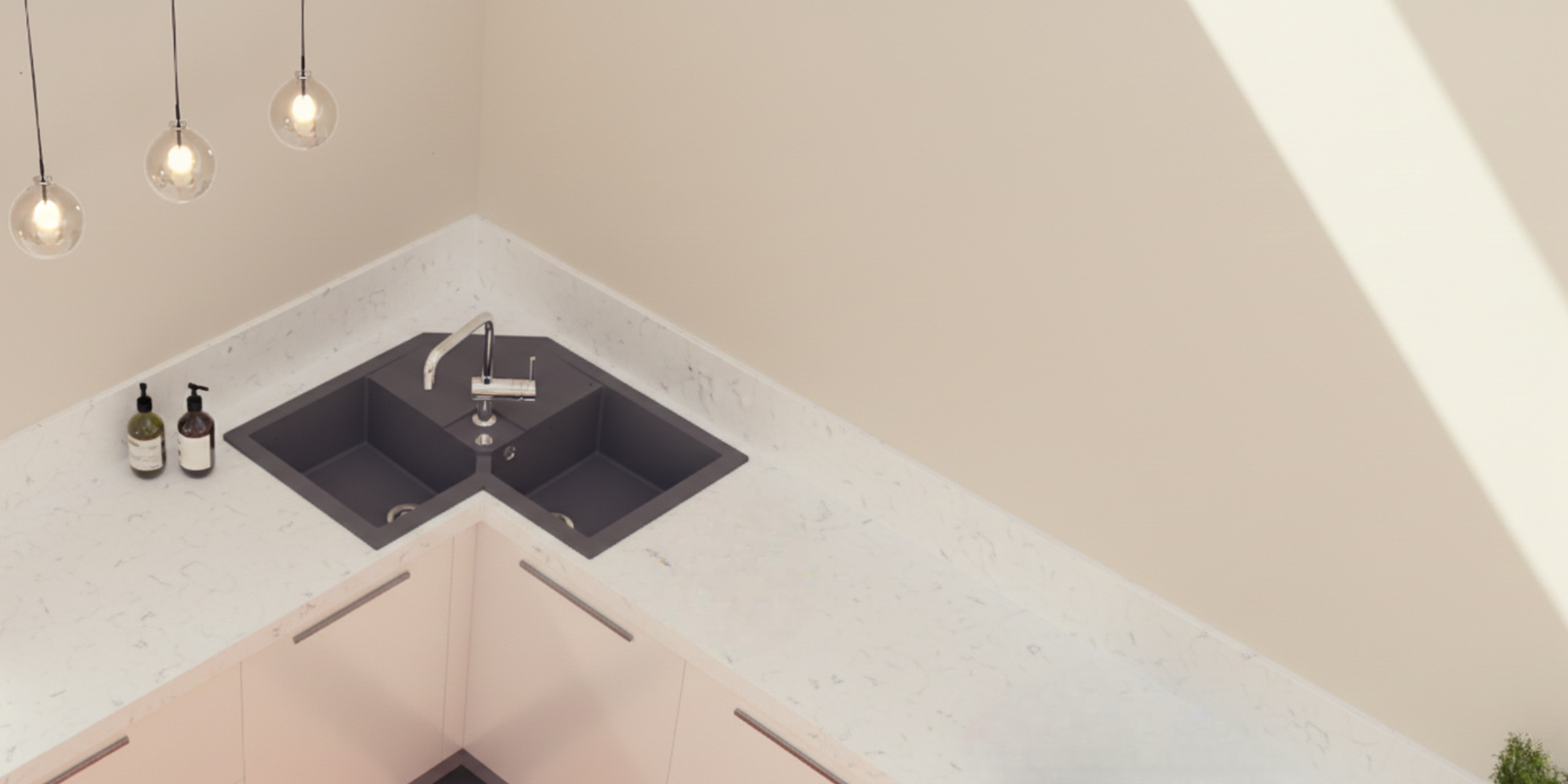 En granit gris, l’évier VOZ d’angle à 2 bacs est idéal pour une cuisine moderne et ergonomique.